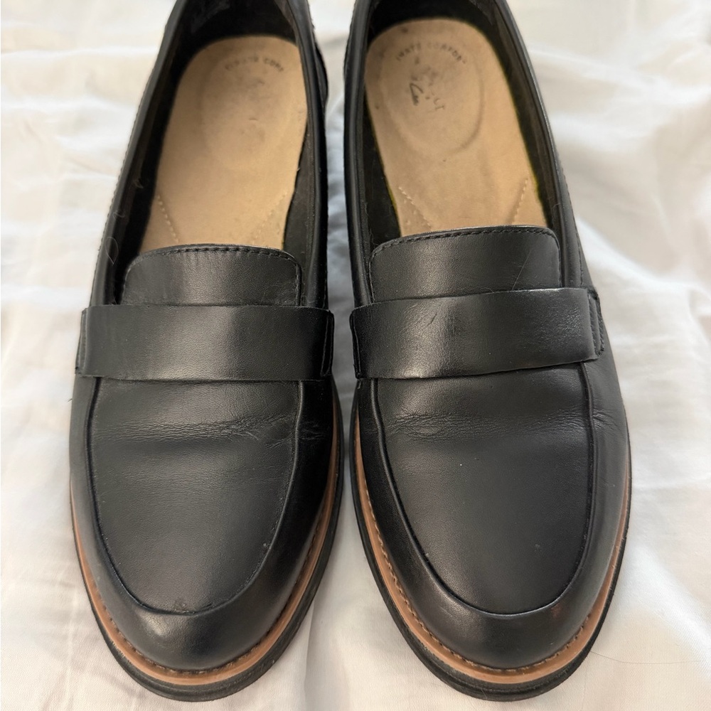 Clark’s Classic Black Leather Loafers with Brown Trim